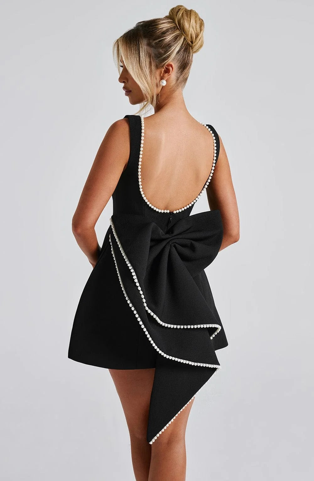 Pearl Trim A-Line Mini Dress Statement Bow Back Sleeveless Flowing Silhouette