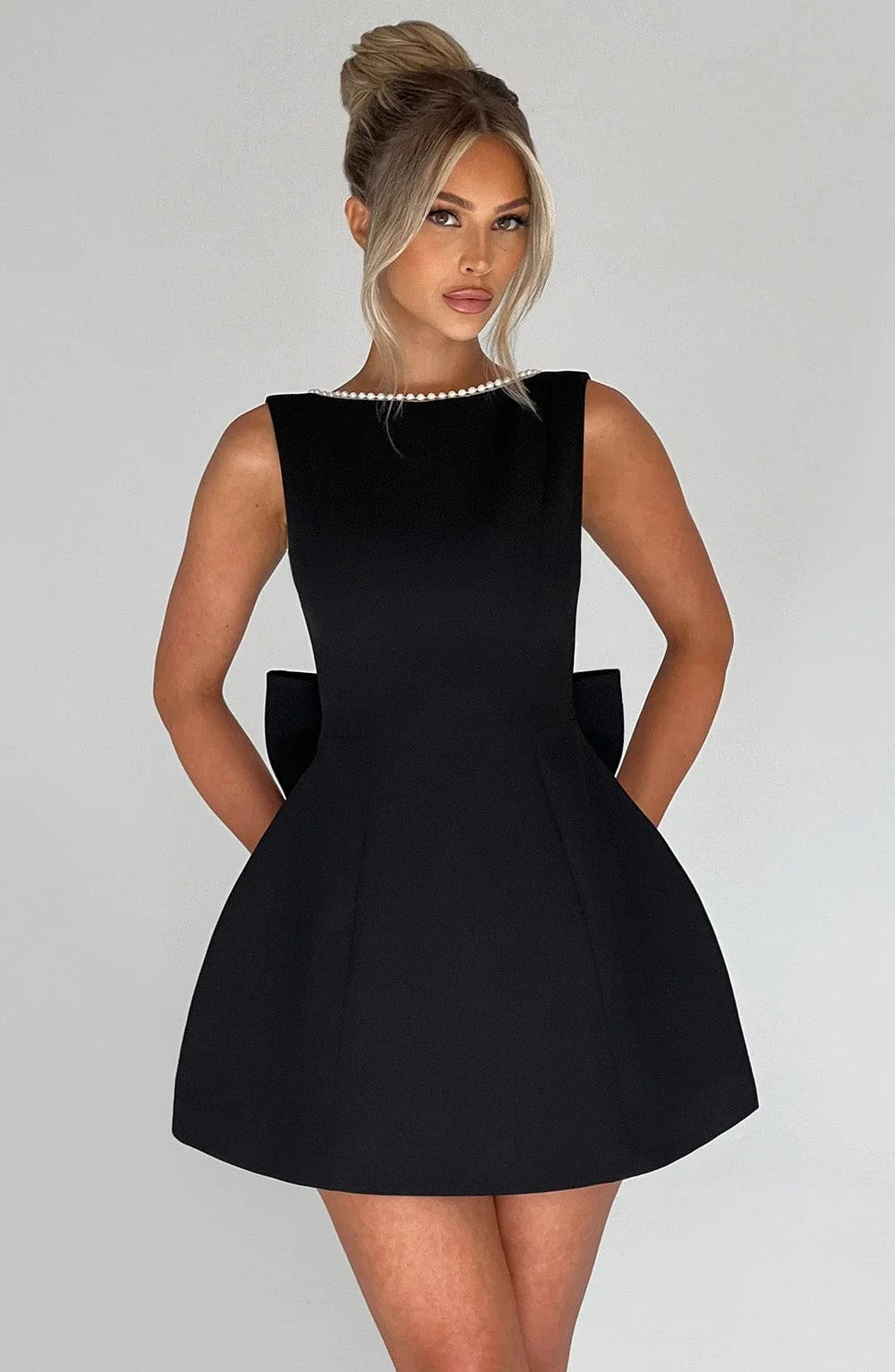 Pearl Trim A-Line Mini Dress Statement Bow Back Sleeveless Flowing Silhouette